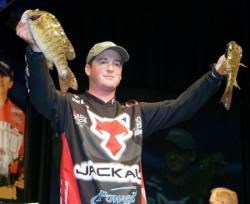 Fourth-place pro Cody Meyer holds up two nice smallmouths he caught on day two of the Forrest Wood Cup.