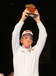 Bemidji, Minn., co-angler Lowell Joy holds up his trophy for winning th 2009 FLW Walleye Tour Championship. 