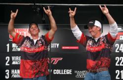 North Carolina State anglers Kevin Beverley and Ben Dziwulski give the Wolfpack sign after celebrating their comeback victory.