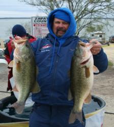 Third-place pro Randy White holds up his two biggest bass from day two on Falcon Lake.