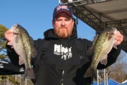 Shane Melton caught three bass Thursday weighing 6 pounds, 15 ounces to retain his lead in the Co-angler Division.