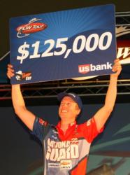 National Guard pro Brent Ehrler holds up his check for winning the 2010 FLW Tour opener on Table Rock Lake.