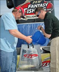 Pro leader Bub Taylor gets some water on his fish after his weigh-in.