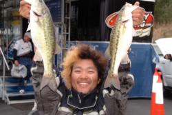 Naohiro Maruo of Takamatsu Kagawa, Japan, struck a dramatic pose for the camera after finishing in second place heading into the final day of FLW Tour co-angler competition on Lake Norman.