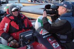 FLW Outdoors television camera crews film second-place qualifier Rusty Trancygier before takeoff.