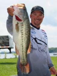 Pro leader Roy Hawk holds up his kicker largemouth from day one on the Fort Loudoun-Tellico lakes.