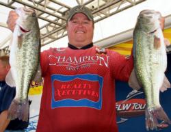 Fourth-place pro James Watson holds up part of his 16-pound, 8-ounce catch.