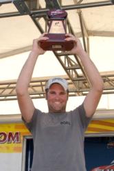 Spencer Shuffield holds up his trophy for winning the FLW Tour event on the Fort Loudoun-Tellico lakes.