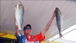 Pro winner Bill Shimota holds up his two biggest fish from day three on the Mississippi River.