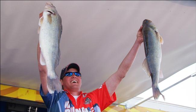 Pro winner Bill Shimota holds up his two biggest fish from day three on the Mississippi River.