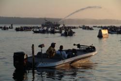 As the Joplin, Ark., Fire Department shoots a ceremonial water cannon in the distance as FLW Tour anglers await the start of takeoff on Lake Ouachita.