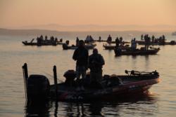 FLW Tour anglers stand for the National Anthem before takeoff on Lake Ouachita.