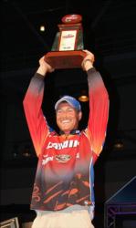 Bryan Thrift holds up his trophy for winning Angler of the Year on the 2010 FLW Tour. 