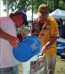 Pro leader Greg Pugh gets a shot of water on his fish after taking the top spot.
