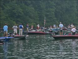 Anglers pause for the playing of the national anthem.