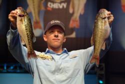 Pro Kevin Hawk of Ramona, Calif., shows off his first-place catch of 14 pounds, 12 ounces during the opening round of 2010 Forrest Wood Cup competition.