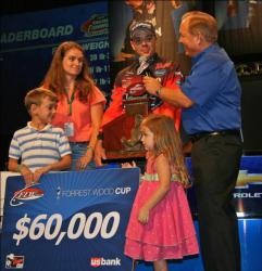 Top co-angler Dearal Rodgers discusses his winning tactics with his wife April, son Fisher and daughter Sarah at his side. 