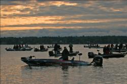 Anglers pause for the national anthem before day three takeoff.