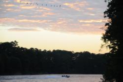 A boat heads out into the day-one dawn at Lake Chickamauga.