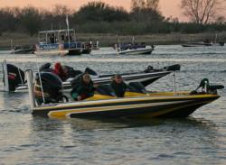Anglers in the early flights prepare for takeoff as others make their way through checkout.