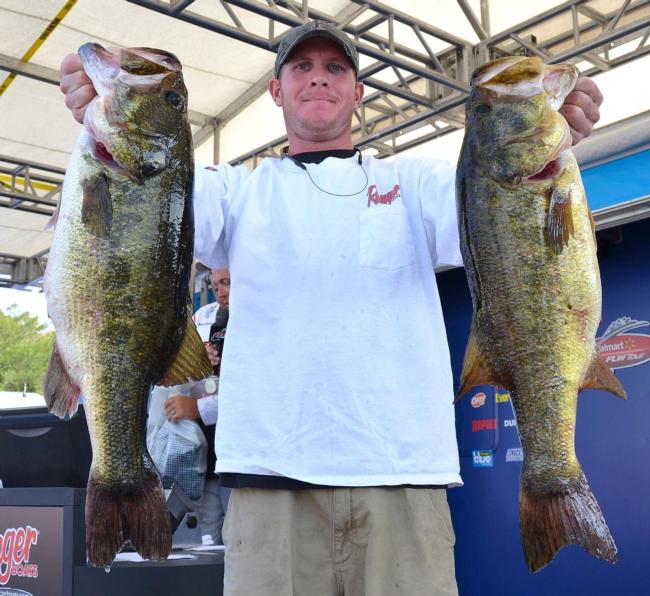 Sixth-place pro Brandon McMillan holds up two 8-pounders from day one on Okeechobee.