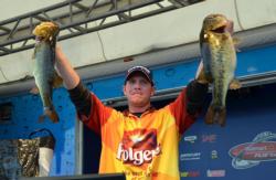 Pro winner Brandon McMillan holds up his two biggest bass from day four on Lake Okeechobee.
