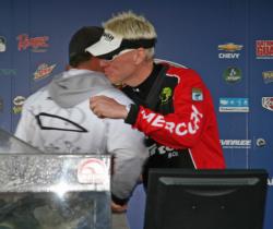 Pro winner David Ryan gets a congratulatory hug from Roy Hawk who led on days one and two.