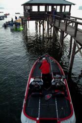 A boater rigs up his tackle before the start of EverStart Series competition on Toledo Bend.