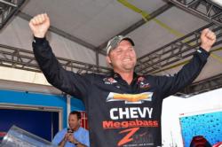 Chevy pro Luke Clausen of Otis Orchards, Wash., raises his hands in victory after capturing the tournament title at the FLW Tour Potomac River event.
