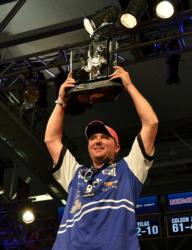 Chad Grigsby holds up his trophy for winning the FLW Tour event on Kentucky Lake. 