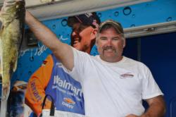 Dan Thill of Lacrosse, Wisc., grabbed the overall lead in the Co-angler Division with a whopping 22-pound, 13-ounce catch on the opening day of FLW Tour Pickwick Lake competition.