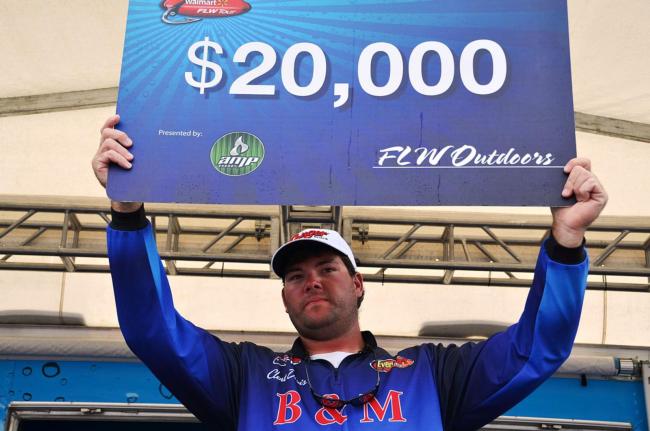 Clent Davis of Montevallo, Ala., shows off his winning check after winning the co-angler title on Pickwick Lake.
