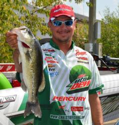 Diet Mountain Dew pro Jason Christie holds up his biggest bass from day two on Lake Ouachita. 