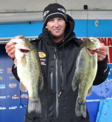 Fourth-place pro Bryan Schmitt holds up a pair of Lake Champlain largemouths.