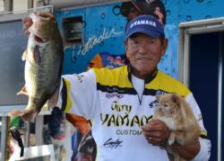 Pro leader Gary Yamamoto holds up his biggest bass from day two on Lake Champlain.