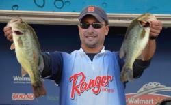 Second-place co-angler Christopher Hall holds up his two biggest bass from day three on Lake Champlain.