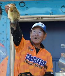 Second-place finisher Gary Yamamoto holds up his biggest bass from day four on Lake Champlain.