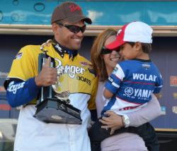 Pro winner David Wolak celebrates his Lake Champlain victory with his wife and son.