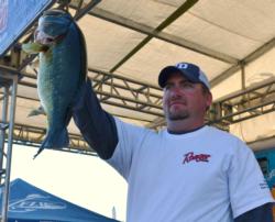 Third-place co-angler Ben Due holds up his kicker from day three on Lake Guntersville.