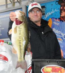 Beecher Strunk of Somerset, Ky., shows off a 9-pound, 6-ounce monster that earned him the co-angler lead and big bass honors on day one.