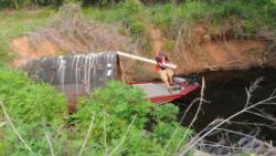 John Cox shimmied a 17-foot aluminum boat through an underground culvert to win on the Red River.