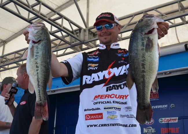 Fifth-place pro Jason Christie holds up two giant Table Rock largemouths.