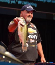 Dion Hibdon shows off a quality largemouth he caught on day one of the 2012 Forrest Wood Cup.