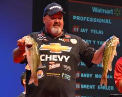 Fifth-place pro Dion Hibdon holds up his two biggest fish from day two on Lake Lanier. 