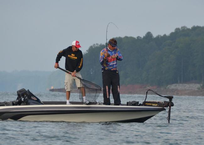 Scott Martin battles a Lake Lanier spotted bass to the boat Friday morning.