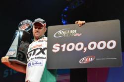 Castrol pro David Dudley shows off his 2012 FLW Tour Angler of the Year bounty.