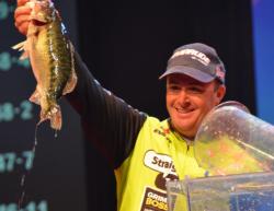 Second-place finisher Scott Canterbury holds up his biggest bass from day four on Lake Lanier. 