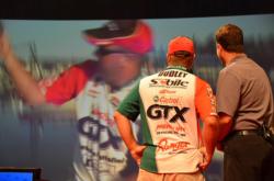 Castrol pro David Dudley watches on-the-water video of himself onstage during weigh-in. Dudley finished the 2012 Forrest Wood Cup in fifth place.