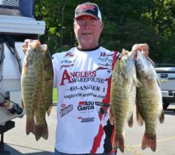 Third-place co-angler Keith Honeycutt holds up his four biggest bass from day one Lake St. Clair.
