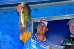 Pro Cory Johnston of Peterborough, Ontario, shows off his second-place catch during the finals of the EverStart Series event on the Potomac River.